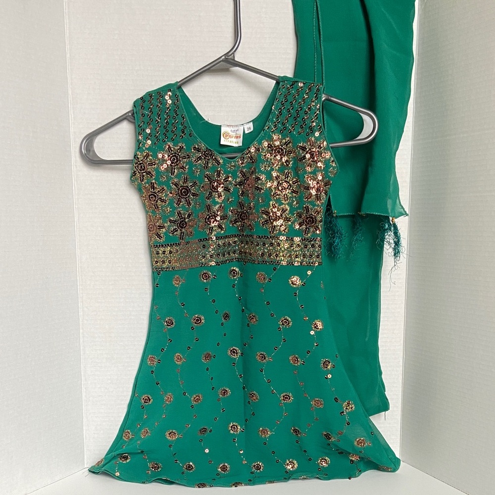 Three-piece Indian green embroidered outfit for girls.